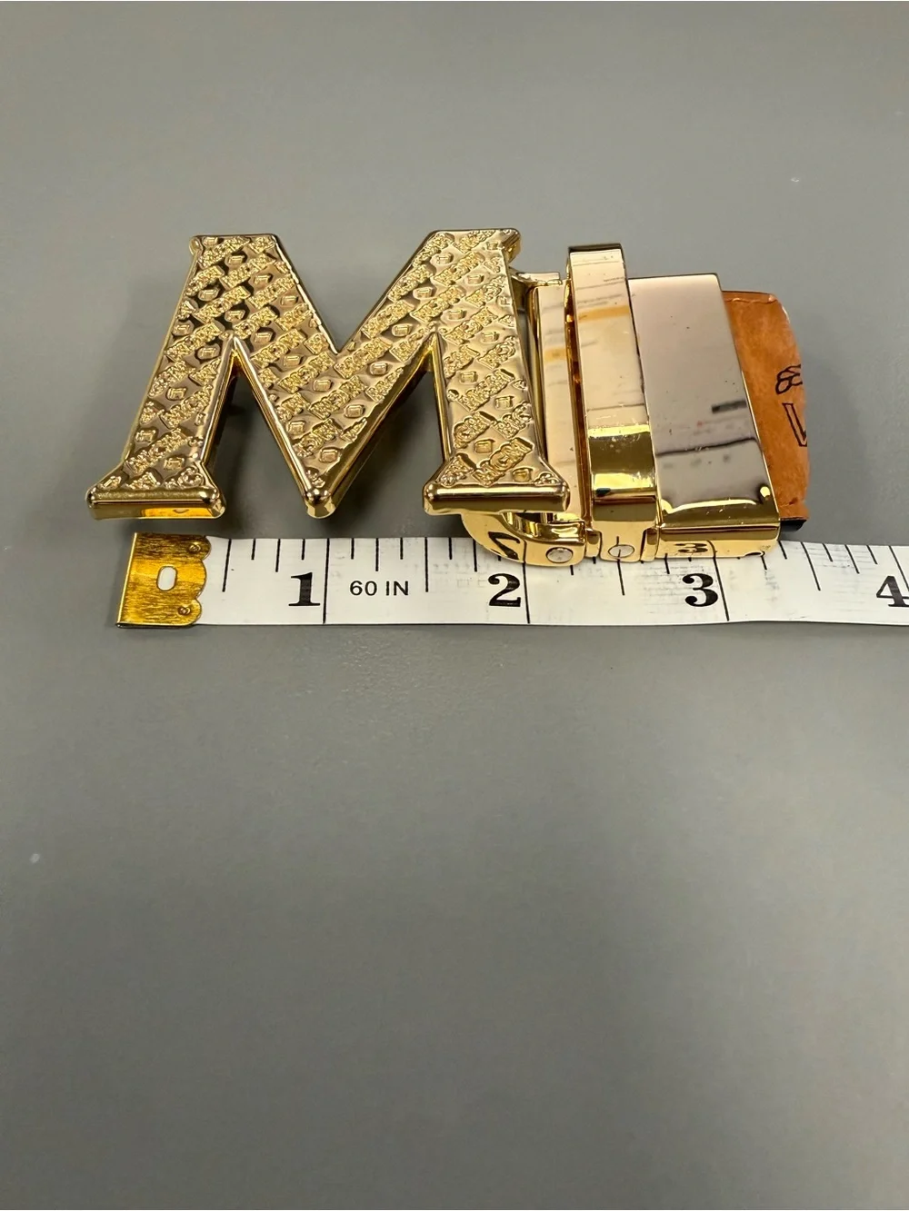 MCM Gold Tone Initial “M” Automatic Ratchet Belt Buckle Designer Logo